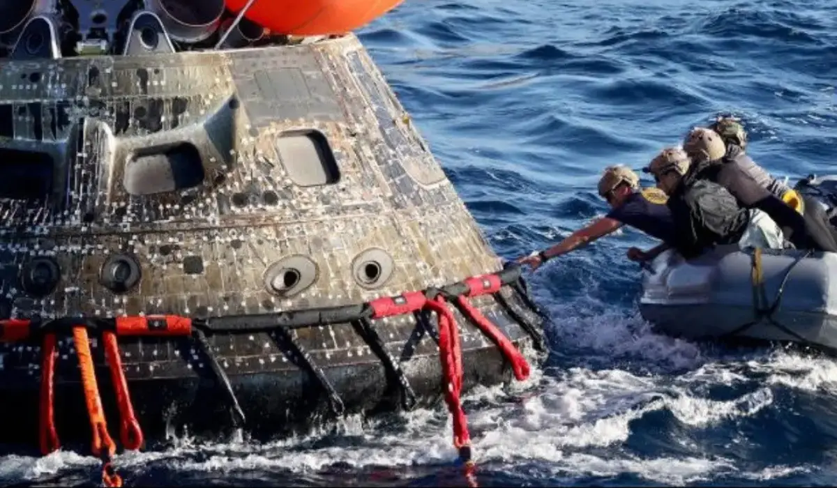 Artemis II spacecraft orbiting Earth with astronauts on mission to Moon and Mars exploration